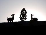 29 Deer And Dharma Wheel Above Old Zhongba Gompa Tibet At Sunset The traditional deer and Dharma wheel are above the Gompa in Old Zhongba in Tibet.